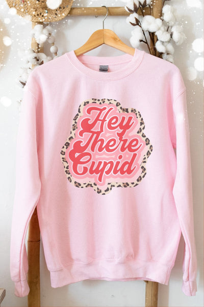 A pink Gildan sweatshirt with 'Hey There Cupid' text and a leopard print pattern on the front.